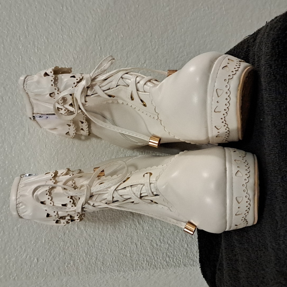 Jingling platform boots with zippers. Cream in color. Size 9.5.